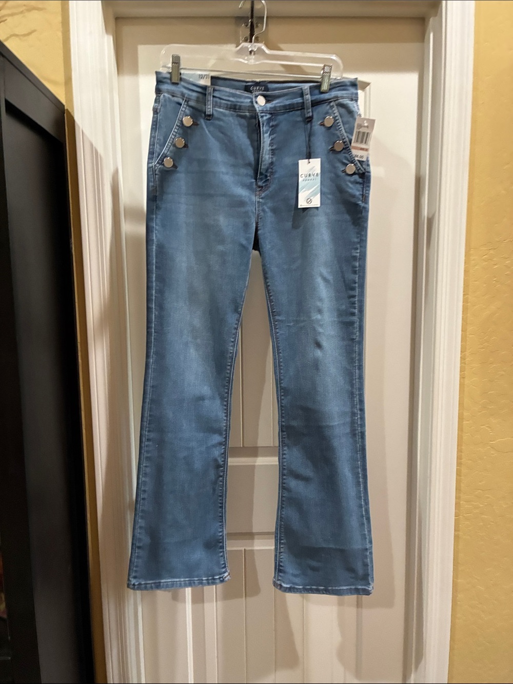 Flared Light Blue Jeans with Accent Buttons